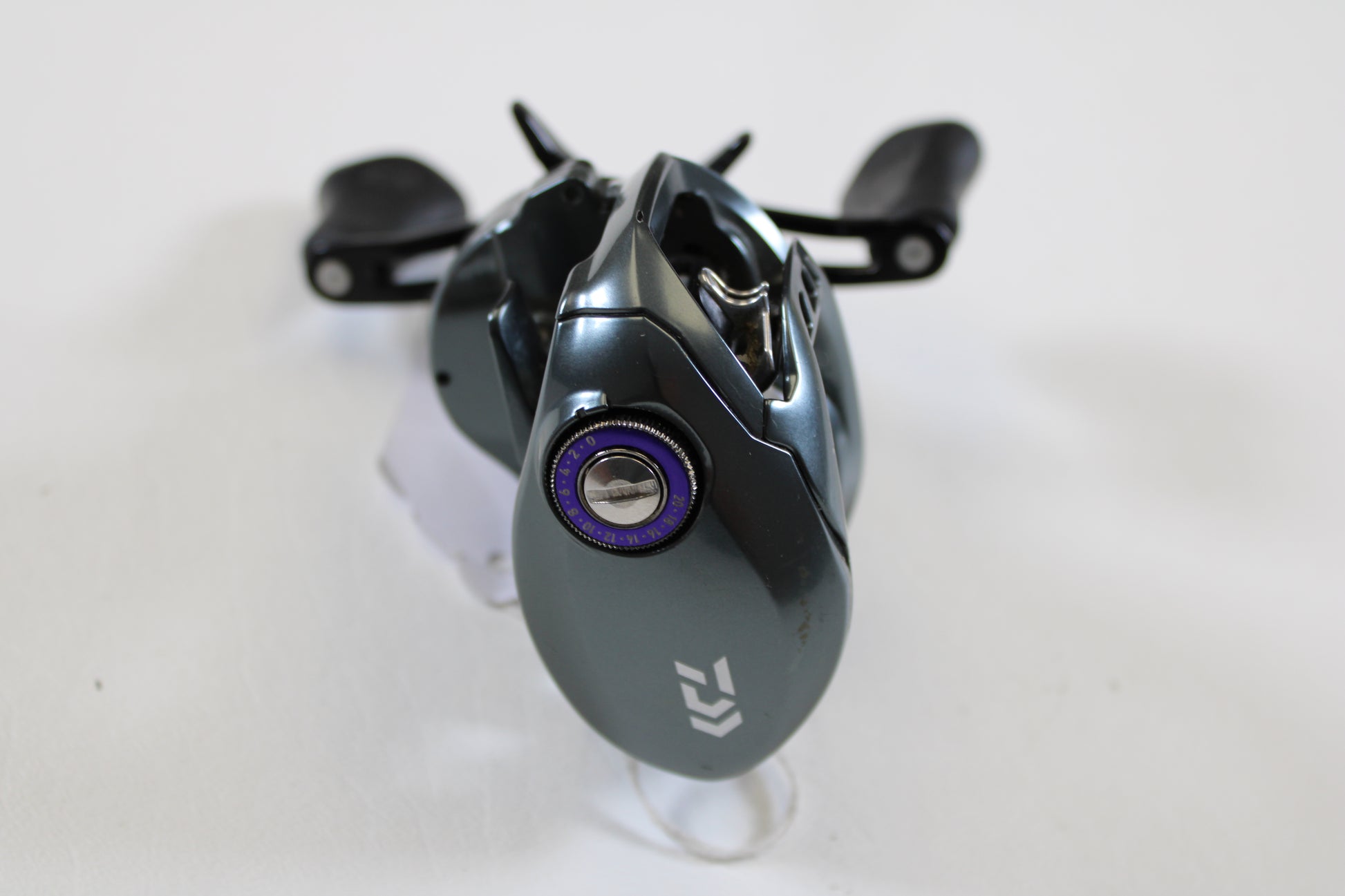 A close-up of a Daiwa Tatula SV TW TTUSV103XS 8.1:1 RH casting reel in good used condition—ideal for our rod and reel trade-in program or to earn store credit on your used Daiwa gear.