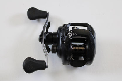 A Daiwa Tatula 150 TAT150HSL 7.3:1 LH casting reel in good used condition is shown against a plain white background—ideal for our Rod and Reel Trade-In Program or store credit on used gear.