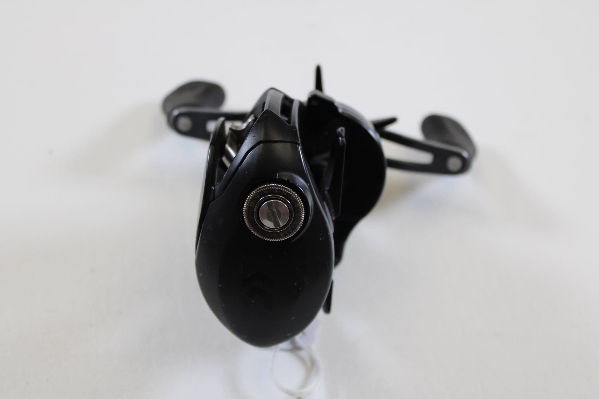 A close-up of a Daiwa Tatula 150 TAT150HSL 7.3:1 LH - Used Casting Reel in good condition, featuring black finish and metal components—ideal for anglers seeking quality used gear or trade-in options.