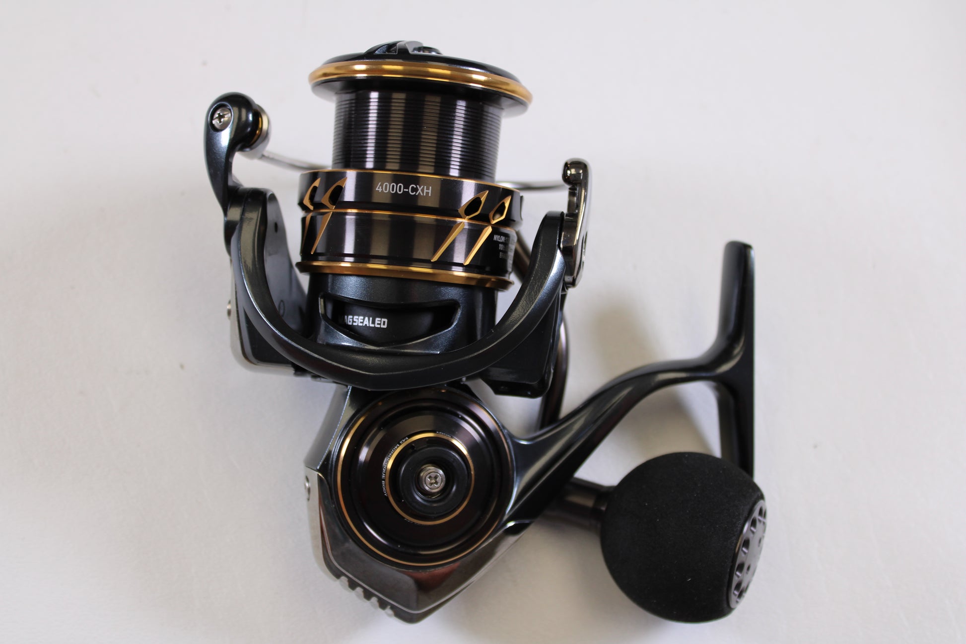 A close-up of the Daiwa Caldia SW 4000-CXH 6.2:1 used spinning reel in excellent condition, displayed on a plain white background—ideal for anglers interested in quality pre-owned Daiwa gear or our rod and reel trade-in program.
