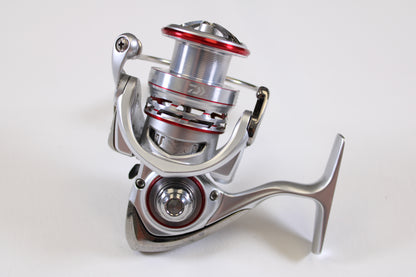 A close-up of the Daiwa Procyon AL PCNALT2500D 5.3:1 Used Spinning Reel in Very Good Condition, photographed on a plain white background—ideal for upgrading via our Rod and Reel Trade-In Program for store credit.
