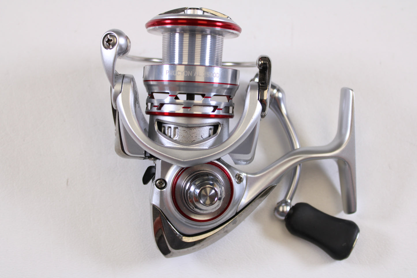 A close-up of the Daiwa Procyon AL PCNALT2500D 5.3:1 Used Spinning Reel in very good condition is shown, ideal for upgrading through our Rod and Reel Trade-In Program or exploring quality used Daiwa gear.