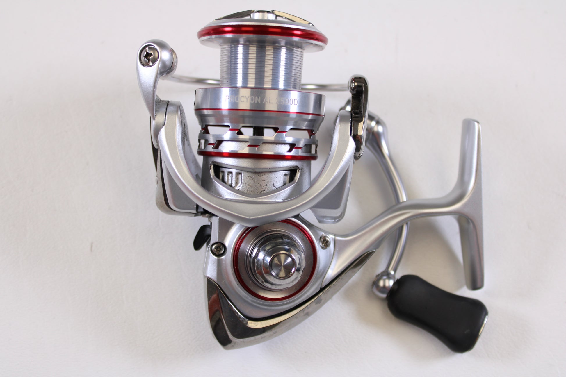 A close-up of the Daiwa Procyon AL PCNALT2500D 5.3:1 Used Spinning Reel in very good condition is shown, ideal for upgrading through our Rod and Reel Trade-In Program or exploring quality used Daiwa gear.