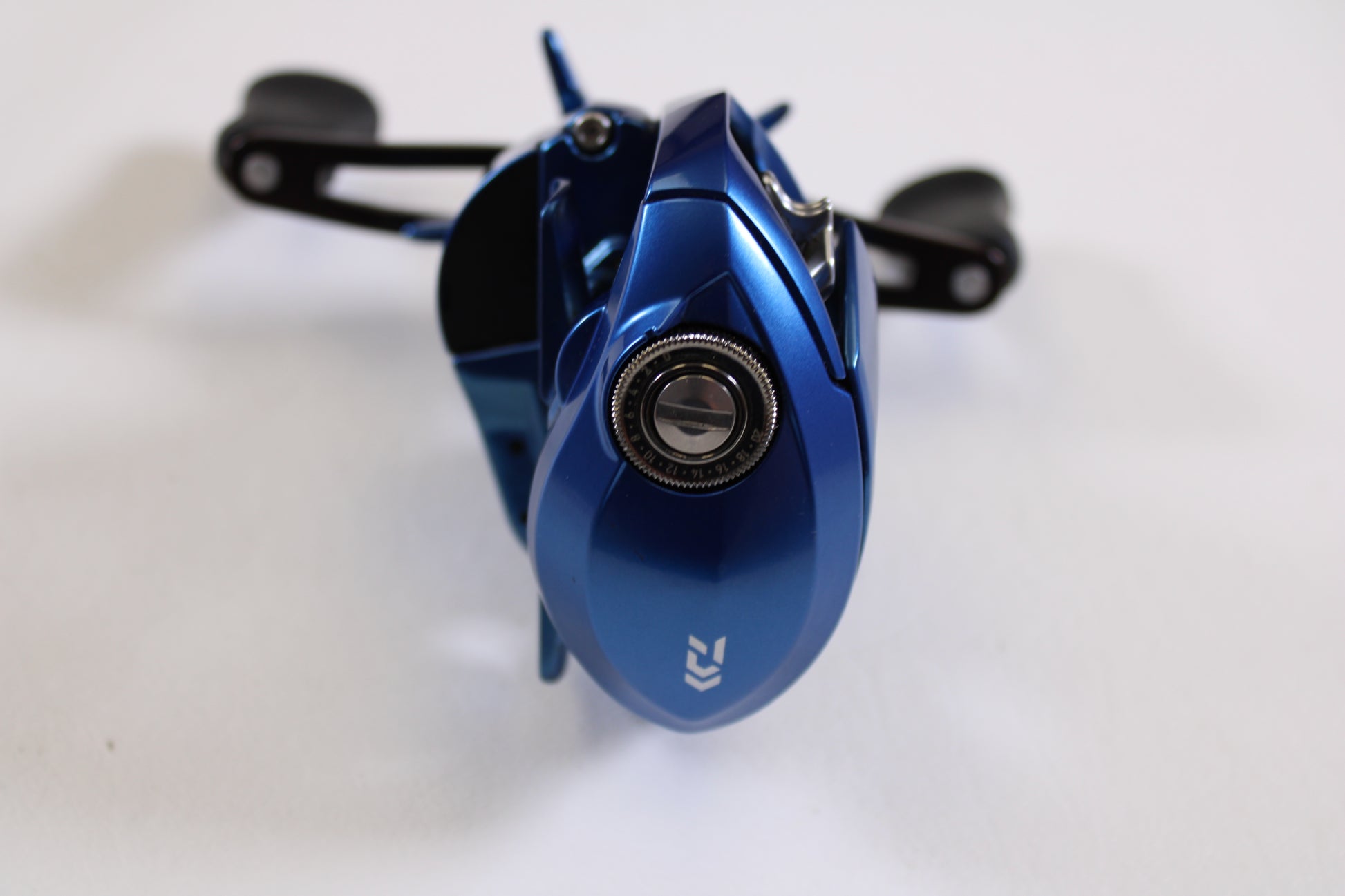 A close-up of the Daiwa Coastal TW 80H CLTW80H 7.1:1 RH Used Casting Reel in excellent condition, photographed from above—ideal for anyone interested in quality used gear or our trade-in program.