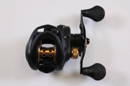 A Lew's Speed Spool Classic Pro CP1SH 7.5:1 RH used baitcasting reel in excellent condition, black and gold with dual rubber handles, is shown from above on a white background—perfect for the rod and reel trade-in program.