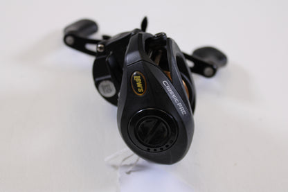 A close-up of a Lew's Speed Spool Classic Pro CP1SH 7.5:1 RH Used Casting Reel in excellent condition on a white surface, highlighting the logo and handle—ideal for our trade-in program or anyone seeking quality used gear.