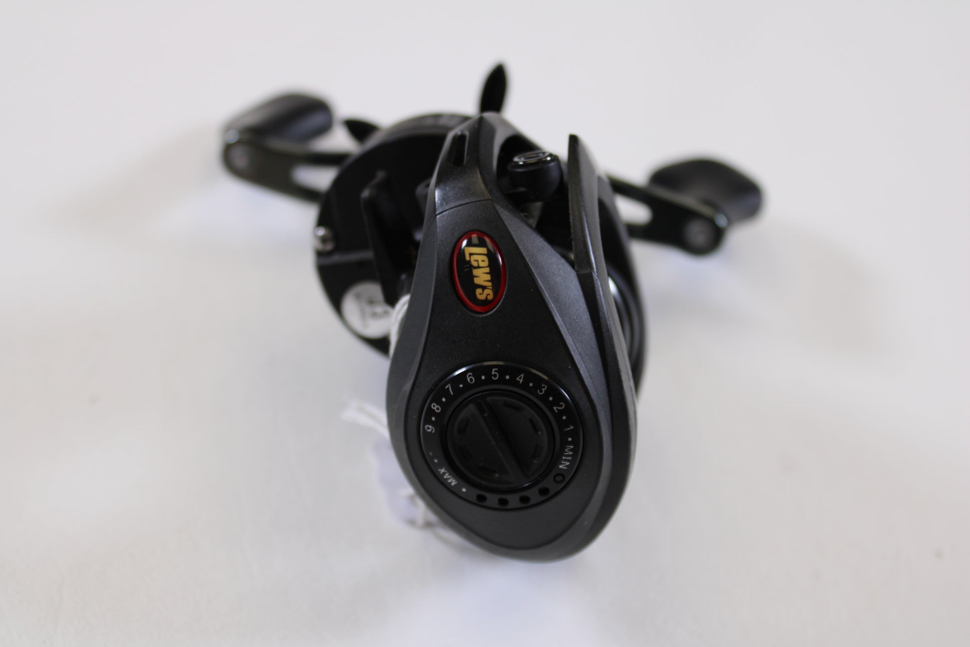 A Lew's Speed Spool SS1SA 5.6:1 RH used casting reel in very good condition is displayed on a white background, brand logo and adjustable dial visible—ideal for anglers upgrading via the Rod and Reel Trade-In Program.