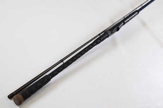 A used St. Croix Seage SES90MLMF2 9'0" medium light 2-piece spinning rod in excellent condition with a textured grip handle, shown on white. Trade in your St. Croix rod through our Rod and Reel Trade-In Program for store credit.