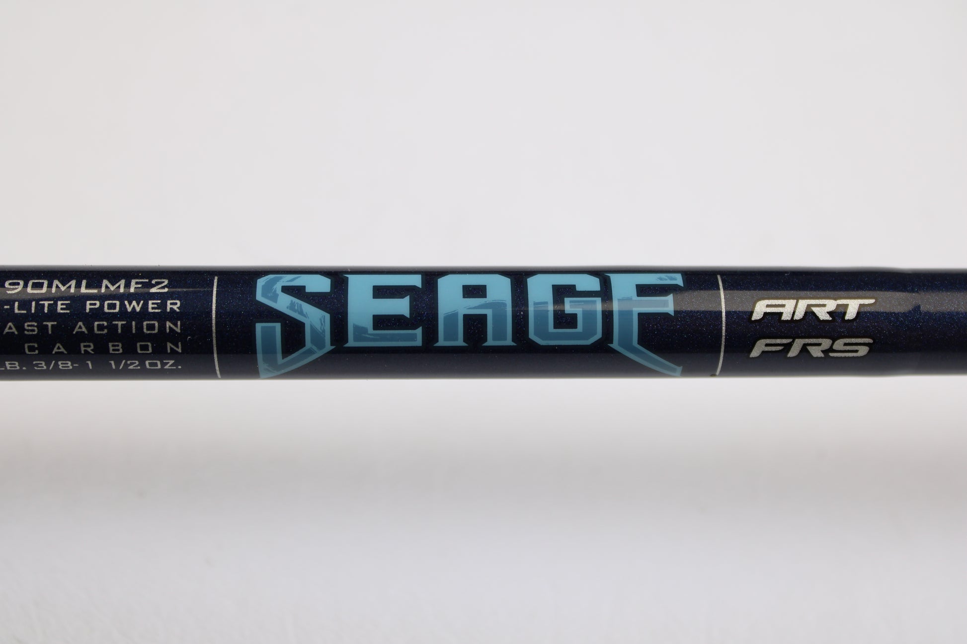 A close-up of the St. Croix Seage SES90MLMF2 9'0" Medium Light 2 Piece Used Spinning Rod in excellent condition, showing bold "SEAGE" lettering and specs—perfect for our Rod and Reel Trade-In Program.