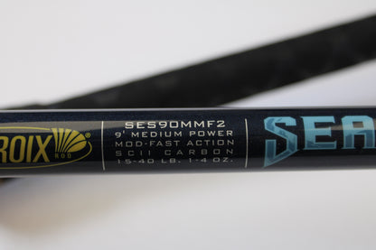 Close-up of a St. Croix Seage SES90MMF2 9'0" Medium 2-Piece Spinning Rod in excellent used condition, logo partially visible—ideal for our Rod and Reel Trade-In Program if you want store credit or quality used gear.