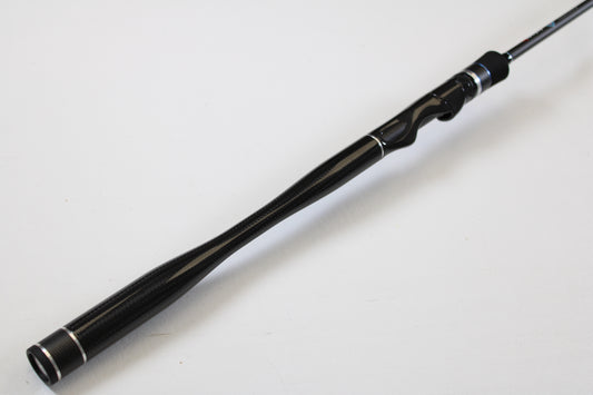 A close-up of the ODM Rods Genesis Inshore BXGX-701LS 7'0" Light used spinning rod in excellent condition, shown against a white background—ideal for anglers seeking quality gear or interested in our trade-in program for store credit.
