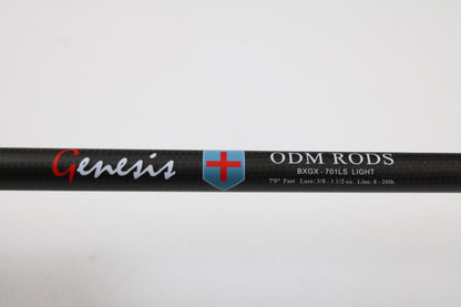 Close-up of a used ODM Rods Genesis Inshore BXGX-701LS 7'0" Light spinning rod in excellent condition, with specs printed on black carbon fiber—great for those interested in quality used gear or trading in a rod and reel.