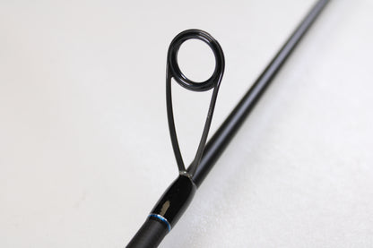 Close-up of the ODM Rods Genesis Inshore BXGX-701LS 7'0" Light—Used Spinning Rod in excellent condition. Features a circular metal guide ring with black supports, ideal for those exploring used gear or our rod and reel trade-in program.