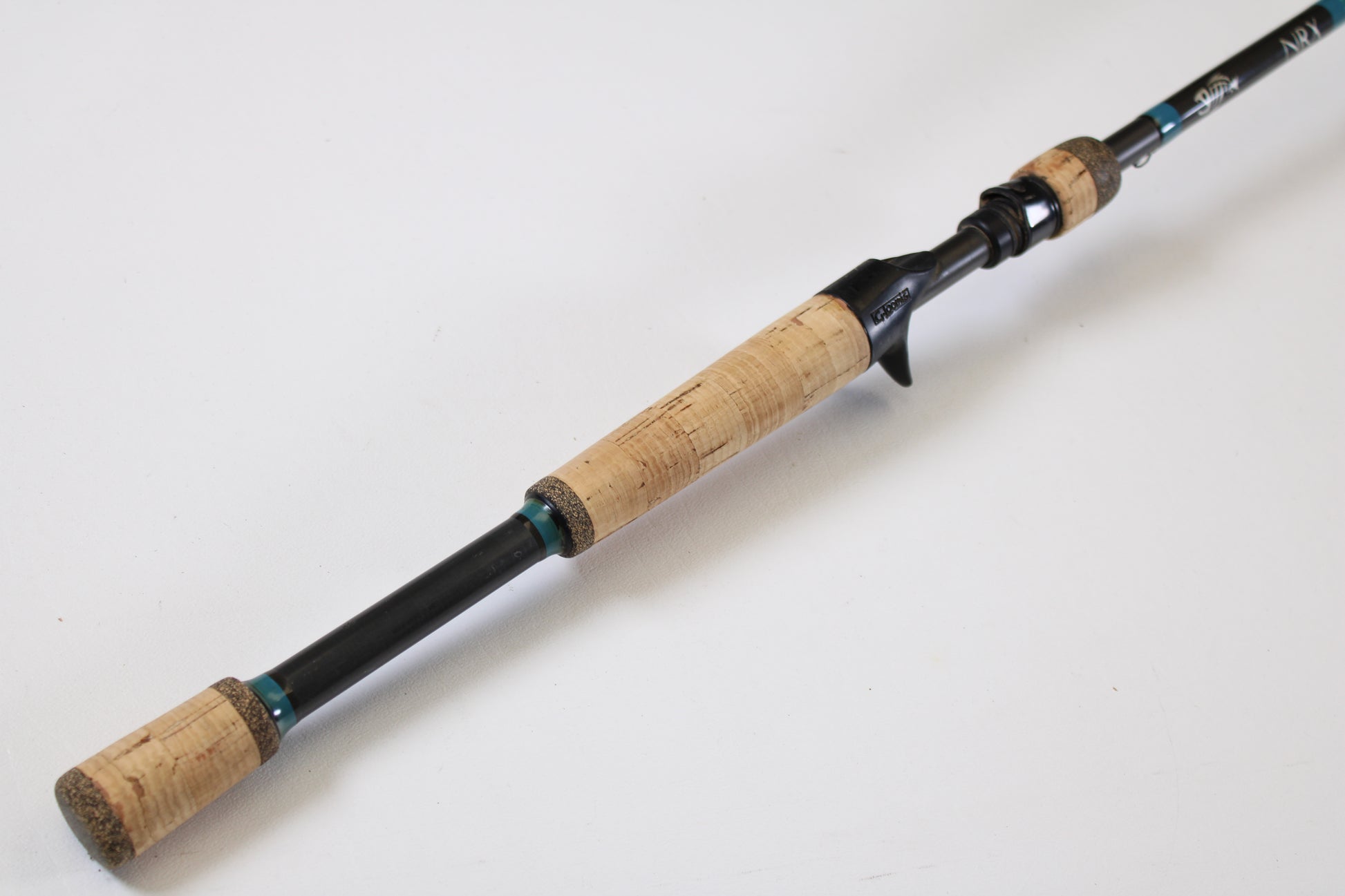 The G. Loomis NRX 893c JWR 7'5" Medium Heavy Used Casting Rod, shown diagonally on white, is perfect for our Rod and Reel Trade-In Program if you want to upgrade your G. Loomis gear for store credit.