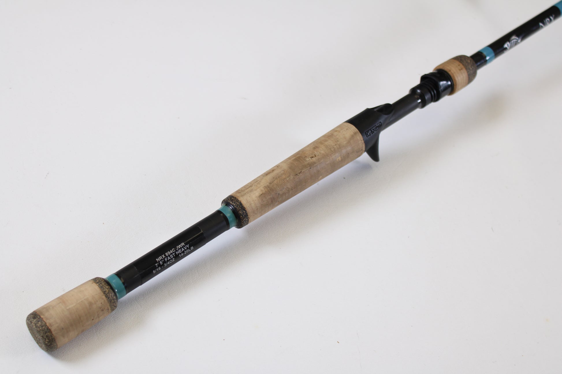 The G. Loomis NRX 894c JWR 7'5" Heavy Used Casting Rod (Excellent Condition) is shown on a white background, ideal for those trading in used gear or using store credit during the rod and reel trade-in event.