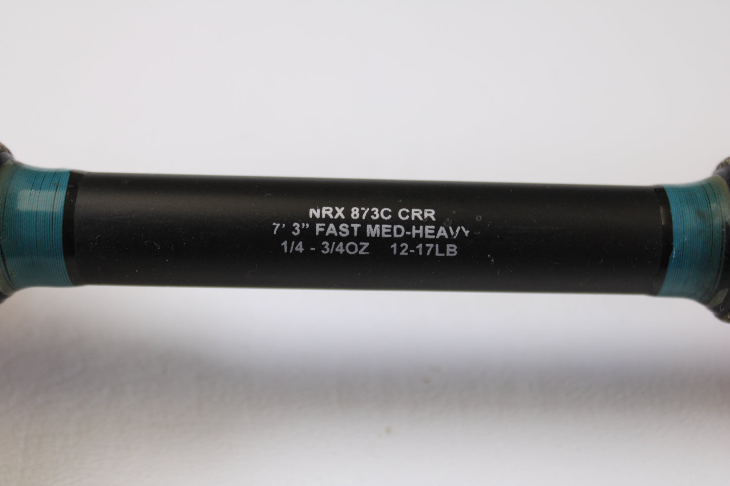 Close-up of the G. Loomis NRX 873c CRR 7'3" Medium Heavy Used Casting Rod in excellent condition, showing specifications printed in white—ideal for our rod and reel trade-in or enhancing your used gear collection.