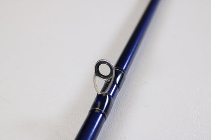 A close-up of the St. Croix Legend Tournament LBC75HMF 7'5" Heavy Used Casting Rod in excellent condition highlights a line guide against a white background—ideal for those looking to trade in used gear for store credit.