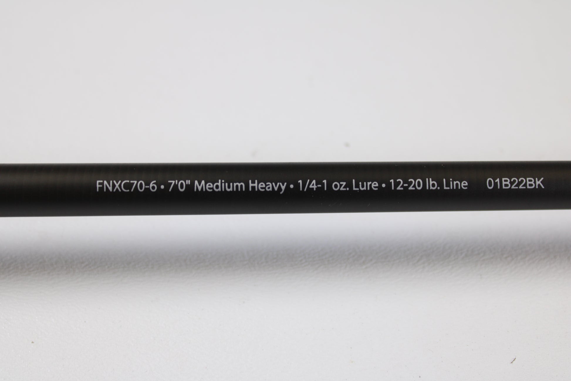 A close-up of the Abu Garcia Fantasista FNXC70-6 7'0" Medium Heavy Used Casting Rod in excellent condition, shown against a white background, perfect for upgrading your gear or trading in your current rod and reel.