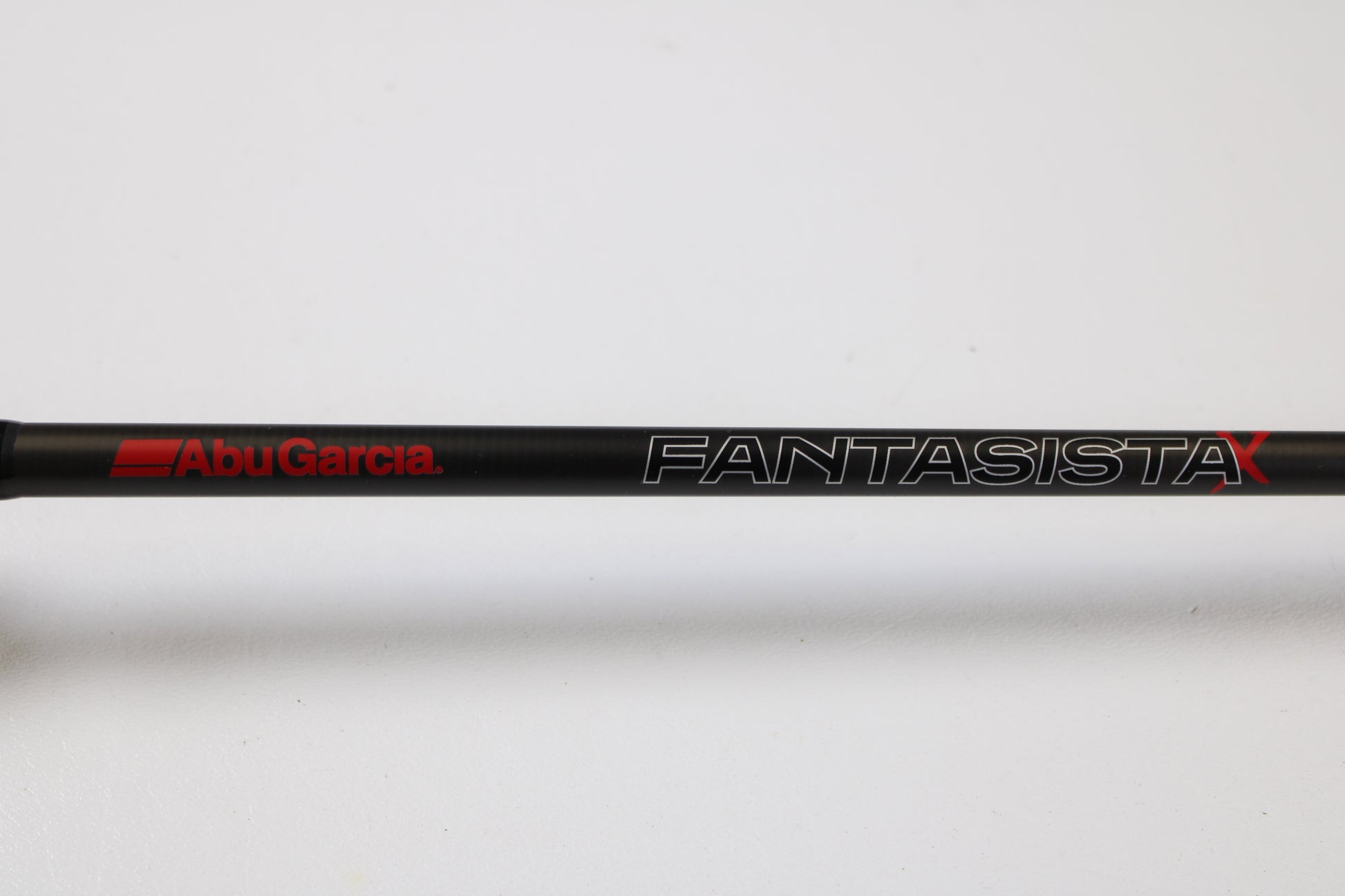 A close-up of the Abu Garcia Fantasista FNXC70-6 7'0" Medium Heavy Used Casting Rod in excellent condition, featuring the bold red "Abu Garcia" logo—ideal for anglers interested in quality pre-owned gear.