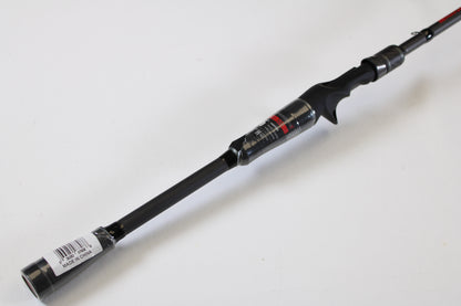 A close-up of an Abu Garcia Fantasista FNXC73-7 7'3" Heavy used casting rod in excellent condition, featuring a trigger grip handle and barcode sticker—ideal for use with store credit or trade-in programs. Set against a plain white background.