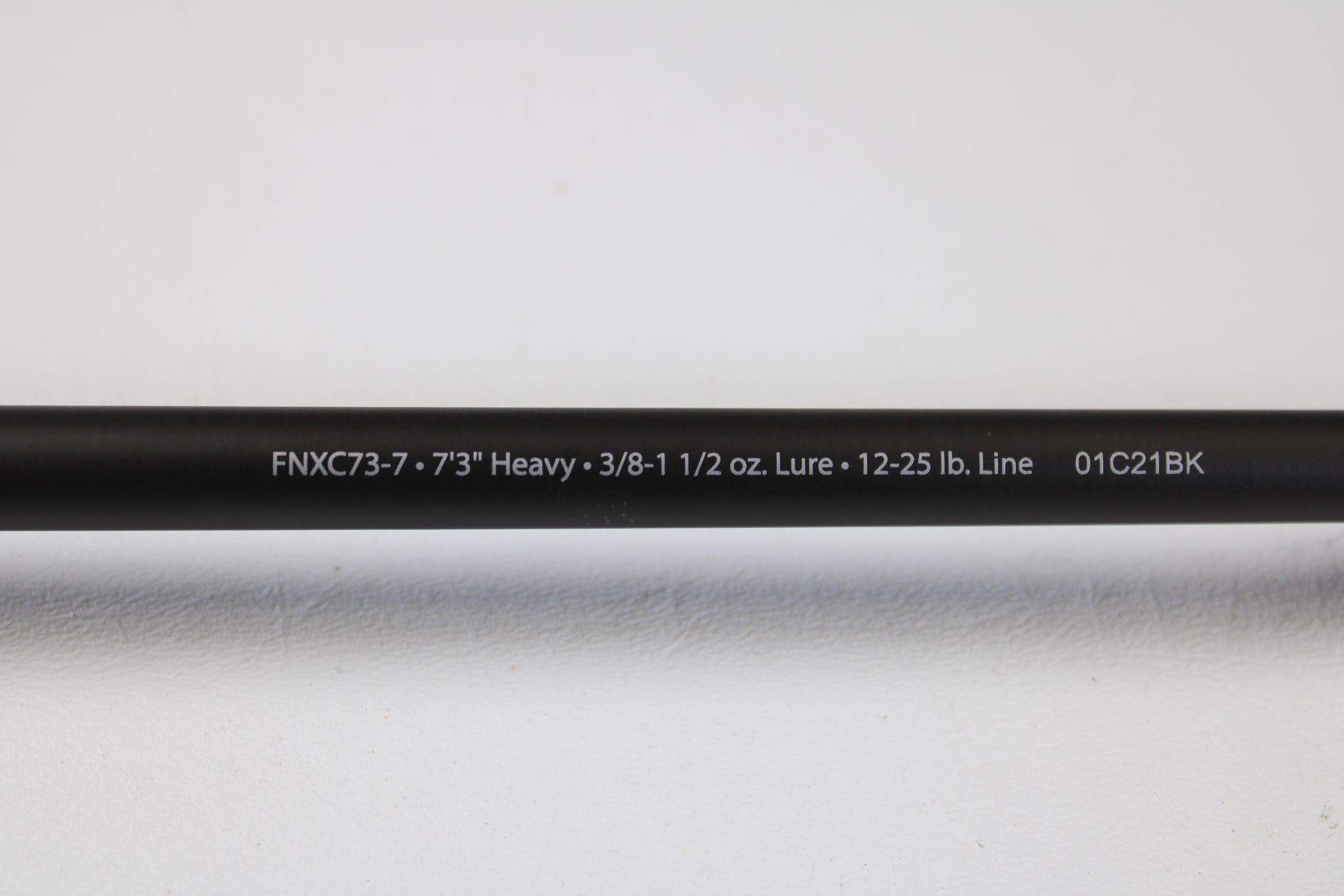 A close-up of the Abu Garcia Fantasista FNXC73-7 7'3" Heavy Used Casting Rod in excellent condition, with specs printed in white—perfect for the Rod and Reel Trade-In Program or earning store credit with your used Abu Garcia gear.