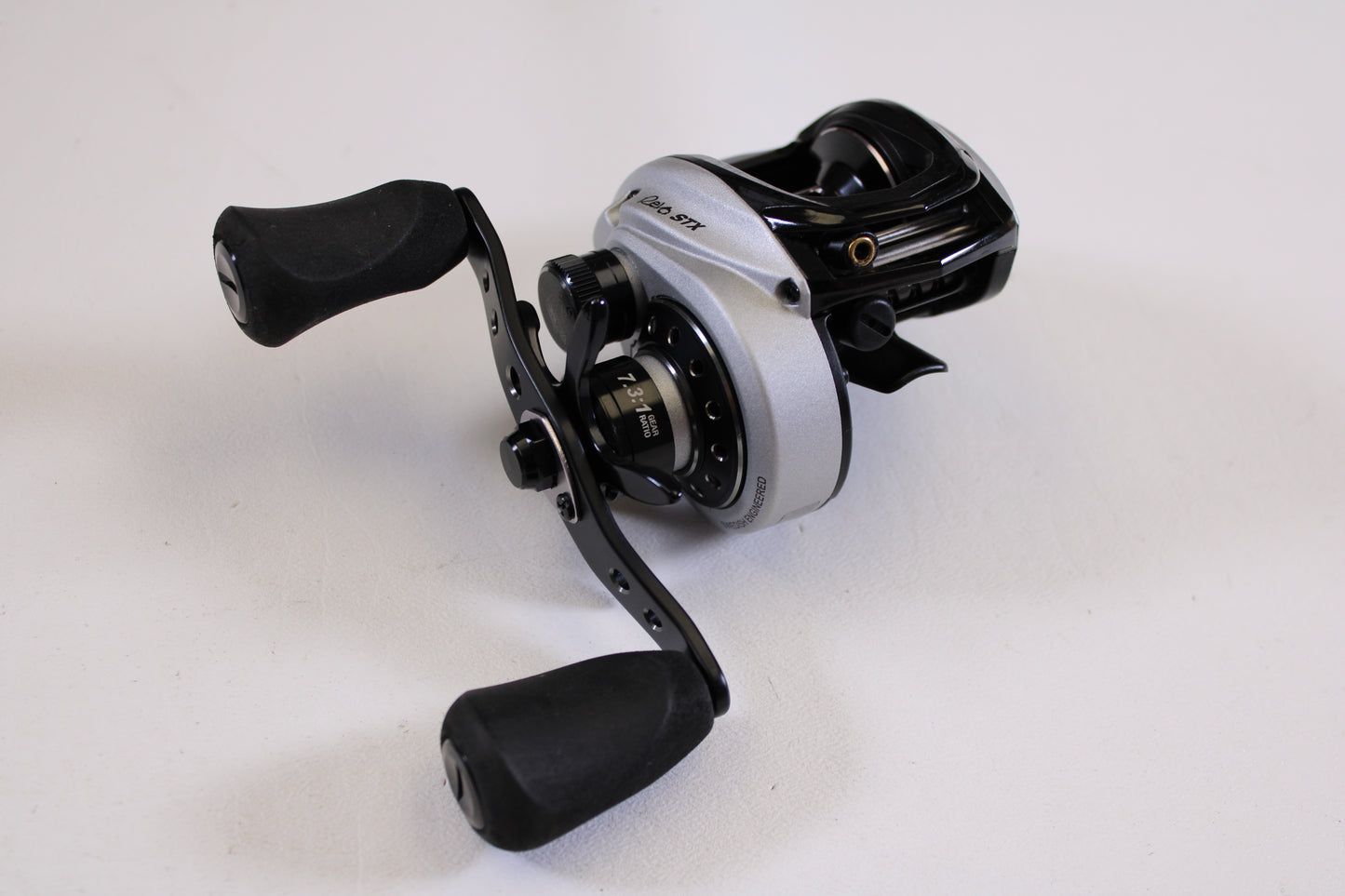 A close-up of an Abu Garcia Revo STX Gen 4 REVO3STX-HS 7.3:1 RH used casting reel in excellent condition—ideal for anyone interested in our rod and reel trade-in program.