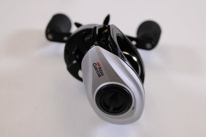 A close-up of an Abu Garcia Revo STX Gen 4 REVO3STX-HS 7.3:1 RH used casting reel in excellent condition, displaying the brand logo and adjustment dial—ideal for those upgrading with our rod and reel trade-in program.
