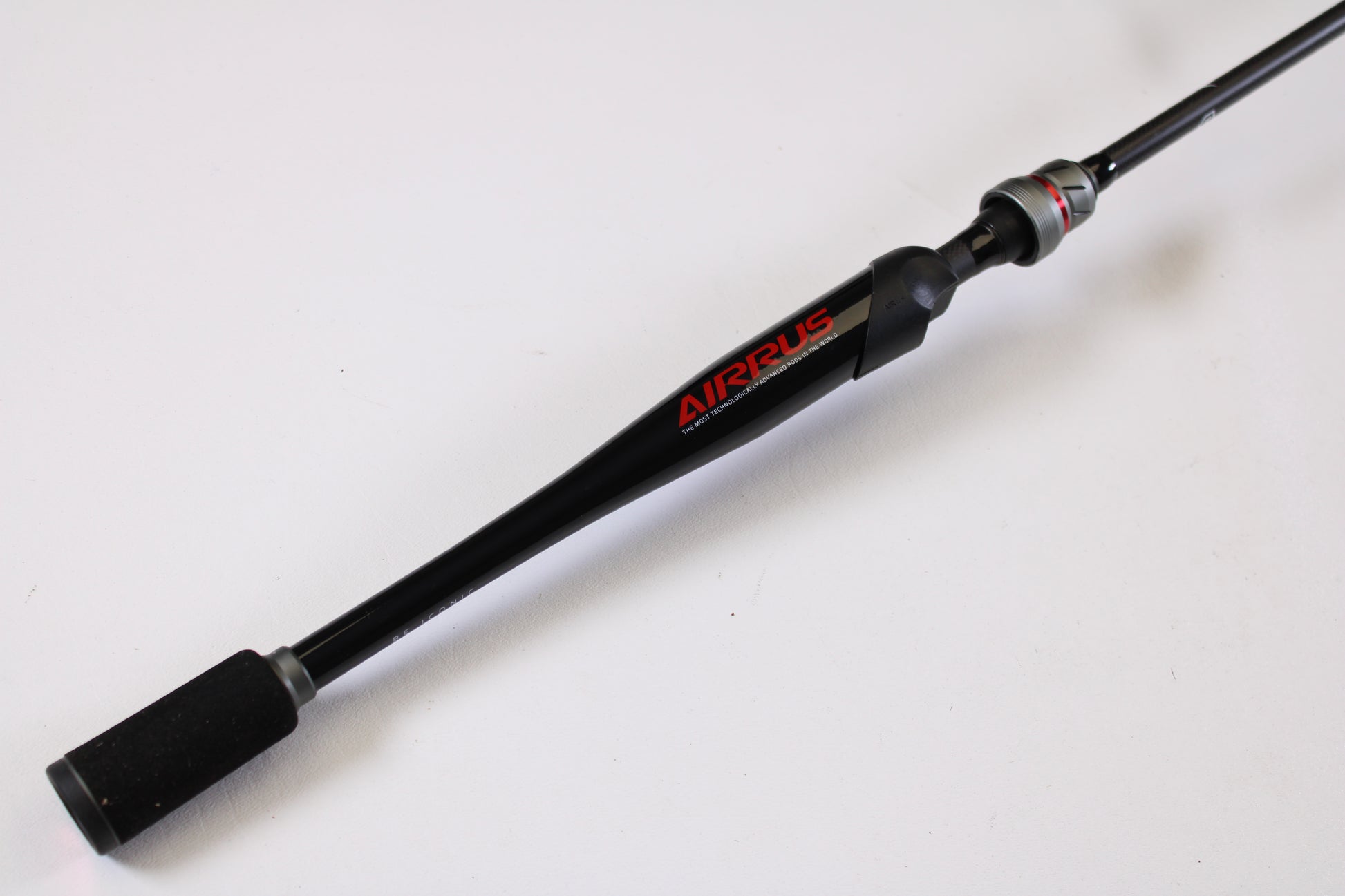 A close-up of the Airrus Stargate ASG681LF-S 6'8" Light used spinning rod in excellent condition, featuring the "AIRRUS" brand name on the handle, set against a plain white background. Ideal for those seeking quality pre-owned gear.