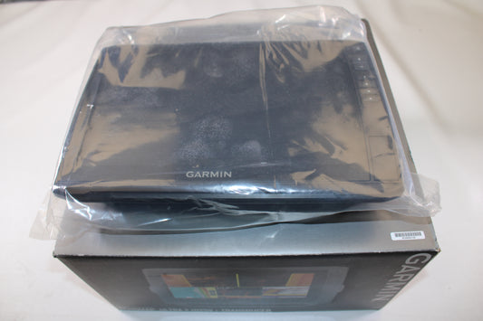A Garmin Echomap Ultra 2 102SV (010-02879-01) electronic device, new with tags and partially wrapped in clear plastic, sits atop its original box, both displaying the Garmin logo.