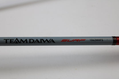 A close-up of the Daiwa Team Daiwa Surf TDSF1062MHFS 10'6" Medium Heavy Used Spinning Rod—ideal for anglers who want to upgrade through our Rod and Reel Trade-In Program and earn store credit for their used gear.
