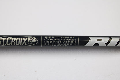 Close-up of a St. Croix Rift RIFSC73MHMF 7'3" Medium Heavy Used Conventional Rod in mint condition. Trade in your used gear for store credit with our rod and reel trade-in program. White text on black background.