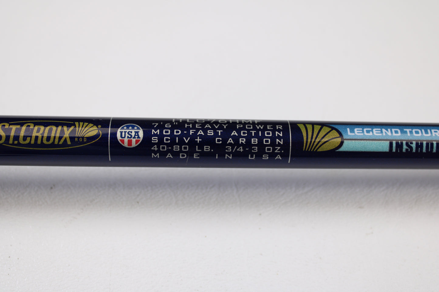Close-up of a St. Croix Legend Tournament Inshore ITLC76HMF 7'6" Heavy casting rod label. Mint condition used gear welcome for rod and reel trade-in—receive store credit on your next purchase!.