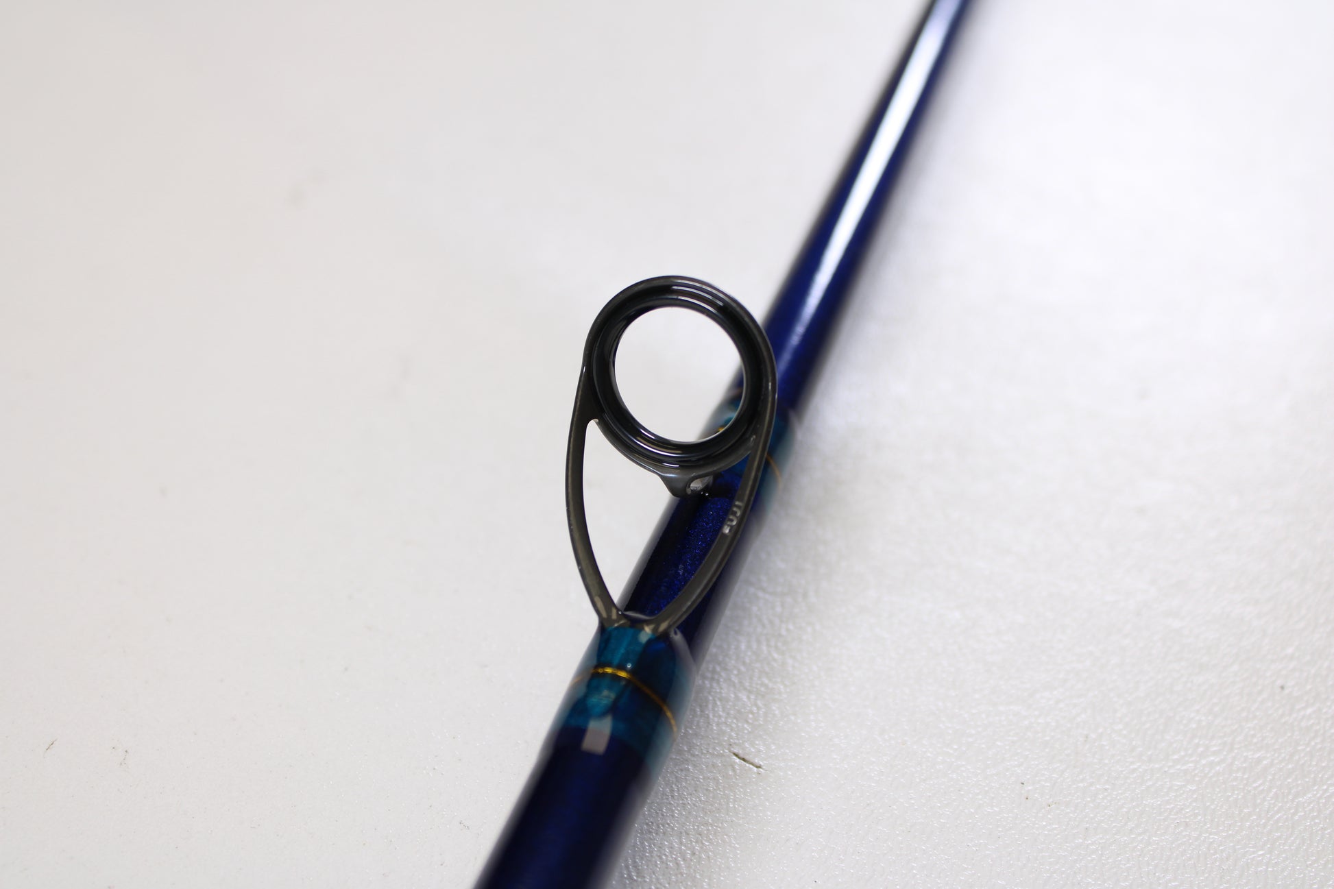 Close-up of the St. Croix Legend Tournament Inshore ITLC711HMF 7'11" Heavy Used Casting Rod (Mint Condition), highlighting a metallic line guide—ideal if you’re considering our Rod and Reel Trade-In Program or an upgrade to your used gear.