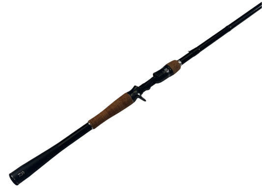 The Daiwa Zillion ZLON731HRB-FL 7'3" Heavy casting rod, in excellent used condition, features a sleek black design with a cork handle and modern reel seat, perfect for upgrading your gear. It's part of the Rod and Reel Trade-In Program.