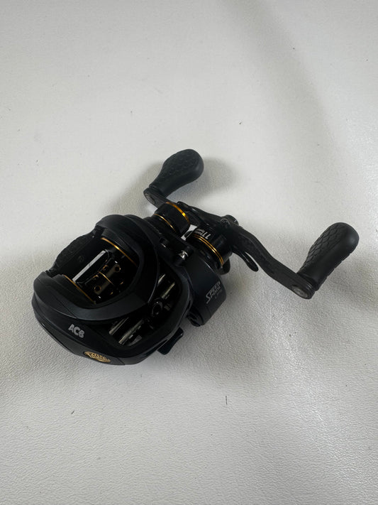 The Lew's Tournament Pro TP1SHLA 7.5:1 used casting reel in excellent condition features gold accents, textured handle grips, and multiple adjustment knobs. Trade in your gear for store credit with our Rod and Reel Trade-In program!.