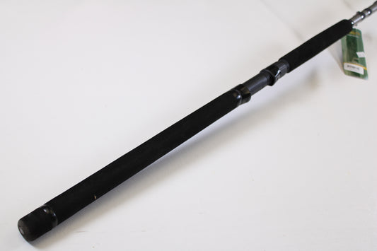 A close-up of the St. Croix Mojo Musky Trolling MMT90HM2 9'0" Heavy – a used casting rod in mint condition with a black foam grip, metal reel seat, and green tag, ideal for our Rod and Reel Trade-In Program. Plain white background.