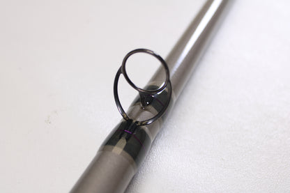 Close-up of a St. Croix Mojo Musky Trolling MMT90HM2 9'0" Heavy used casting rod guide ring, wrapped in metallic thread—ideal for anglers upgrading gear with our Rod and Reel Trade-In Program for store credit. Mint condition!.