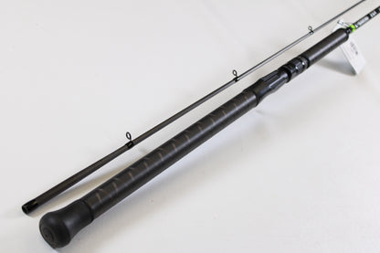 A close-up of the G. Loomis E6X Steelhead 1021-2C HSR GH Used Casting Rod in mint condition, featuring a textured handle and line guides—ideal for those exploring used gear or our rod and reel trade-in program.