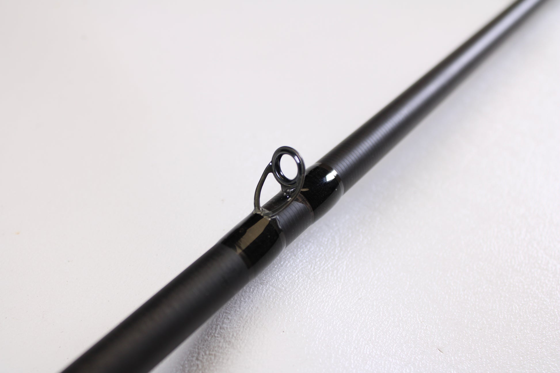Close-up of the 13 Fishing Muse 7'6" Medium Heavy Used Casting Rod in excellent condition, highlighting a line guide—ideal for anyone considering used gear or our rod and reel trade-in program for store credit.