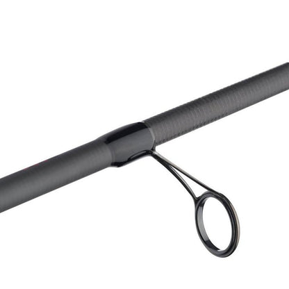 Close-up of an Abu Garcia Veritas Tournament Spinning Rod 7'0" Medium | VXTS70-5 section, showcasing a textured dark gray finish with a glossy black guide ring, embodying the precision and quality expected from an Abu Garcia tournament rod.