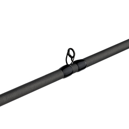 Close-up of the Abu Garcia Zenon Casting Rod 7'2" Heavy (ZENC72-7) reveals a sleek black guide ring and textured grey finish, highlighting its cylindrical, minimalistic design enhanced by Powerlux 1000 technology.