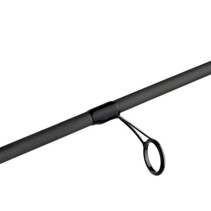 A close-up of an Abu Garcia Zenon Spinning Rod 6'10" Medium Light | ZENS610-4 showcases a black guide loop on the sleek, gray Powerlux 1000 rod. The smooth surface pairs with the Fuji reel seat for perfect line alignment against a white background.