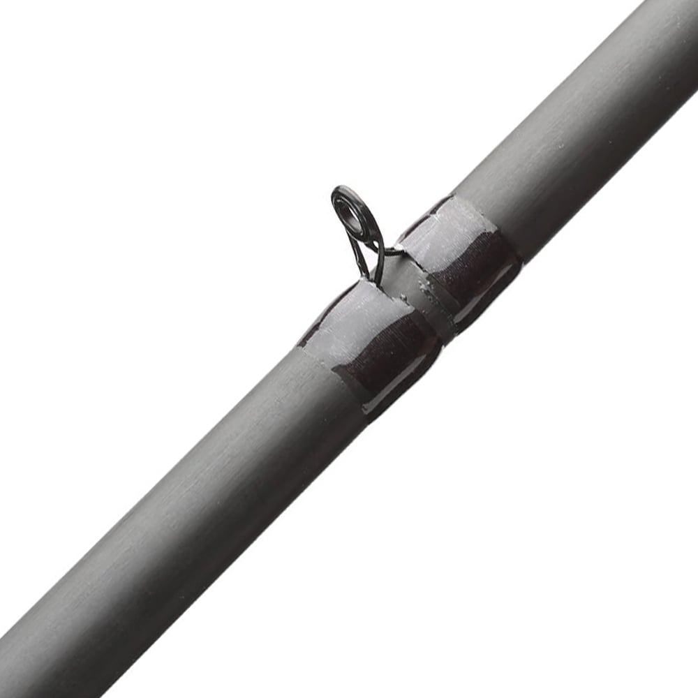 Close-up of the ALX ZOLO Casting Rod PowerBolt 7'11" XX Heavy reveals a section with a metal guide loop. The gray rod's XX Heavy guide is secured with dark thread wrapping, standing out against the plain white background.