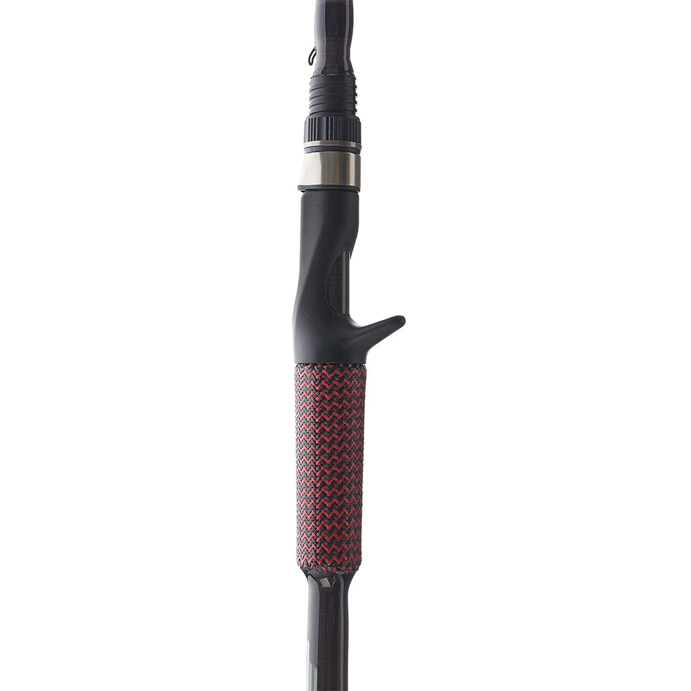 Close-up of the Cashion Rods John Crews ICON Series Casting Rod Worming 7'2" Medium Heavy handle, showing its black trigger grip and textured red-and-black patterned lower section.