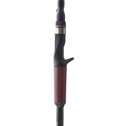 Close-up of the Cashion Rods John Crews ICON Series Casting Rod Worming 7'2" Medium Heavy handle, showing its black trigger grip and textured red-and-black patterned lower section.
