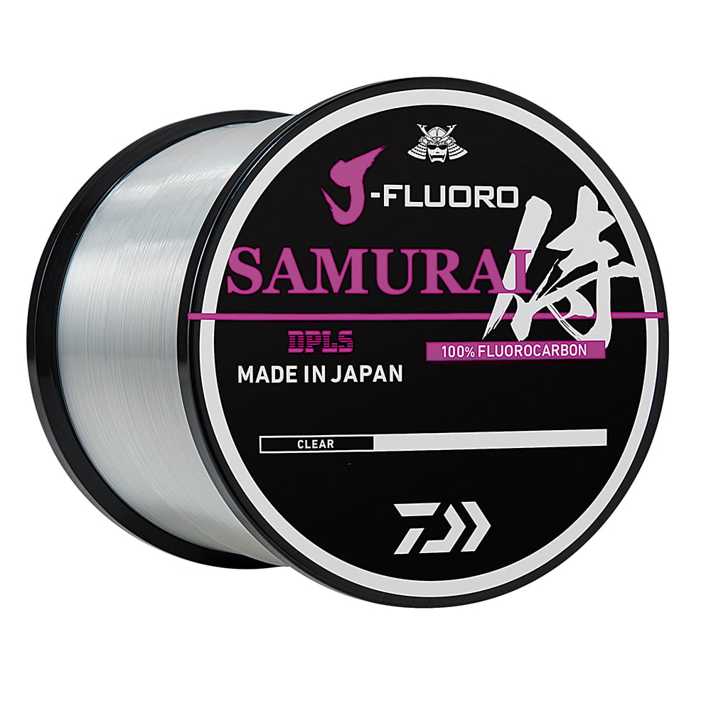 The Daiwa J-Fluoro Samurai FC Fluorocarbon Line 1000yd, made by Daiwa and labeled "100% Fluorocarbon" and "Made in Japan," promises to enhance angler performance. The spool is black with a silver fluorocarbon line, featuring Japanese characters elegantly displayed in white and pink text.
