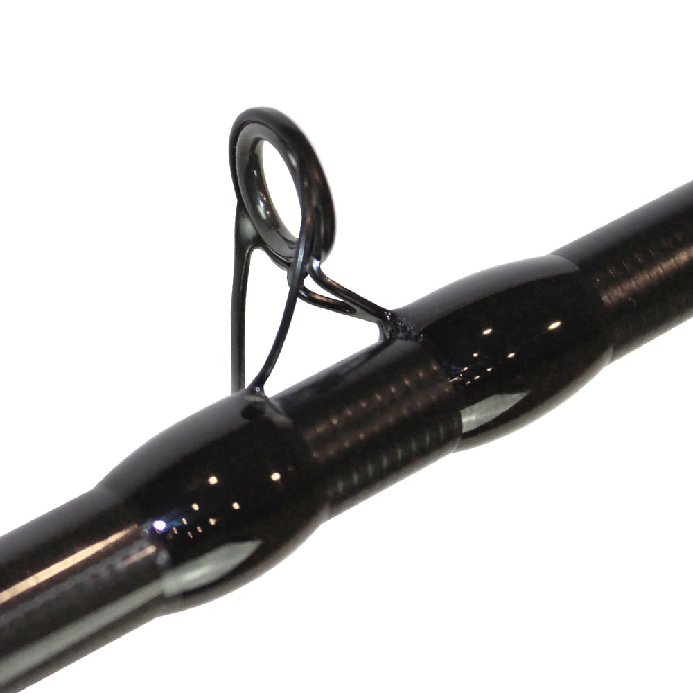 The close-up of the Dobyns Maverick Series MK 735C casting rod reveals a smooth, shiny surface with a focus on the line guide, highlighting the craftsmanship with its metal ring and supportive thread wraps.