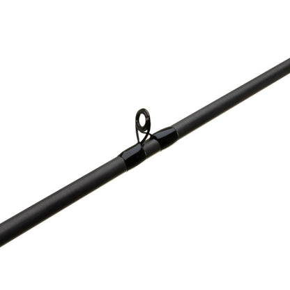 Close-up of a G. Loomis GCX Flip Punch Casting Rod 894C FPR 7'5" Heavy from americanlegacyfishing, highlighting a black eyelet. The dark gray cylindrical design with Multi-Taper ensures precision for bass anglers, with the eyelet guiding the line effortlessly on a white background.