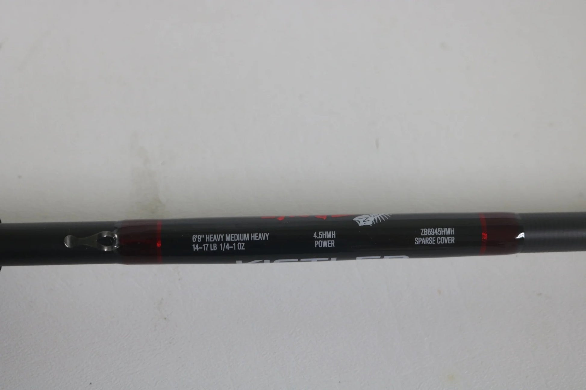 Close-up of a Kistler Z-Bone ZB6945HMH 6'9" Heavy MH used casting rod in excellent condition, featuring specs: 14-71B, 1/4-1 oz, 4.5MH power, and 28845MH/R sparse cover—great for the Rod and Reel Trade-In Program.