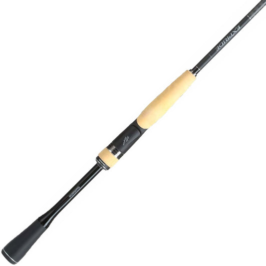 A close-up of the Shimano Expride B Spinning Rod 7'2" Medium Light, showcasing its sleek black design with light beige foam handles and ergonomic style. The rod highlights its modern Carbon Monocoque construction, tilted to reveal the handle and part of the pole.
